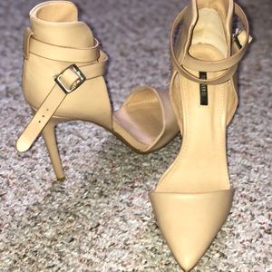 Nude pointed heels.